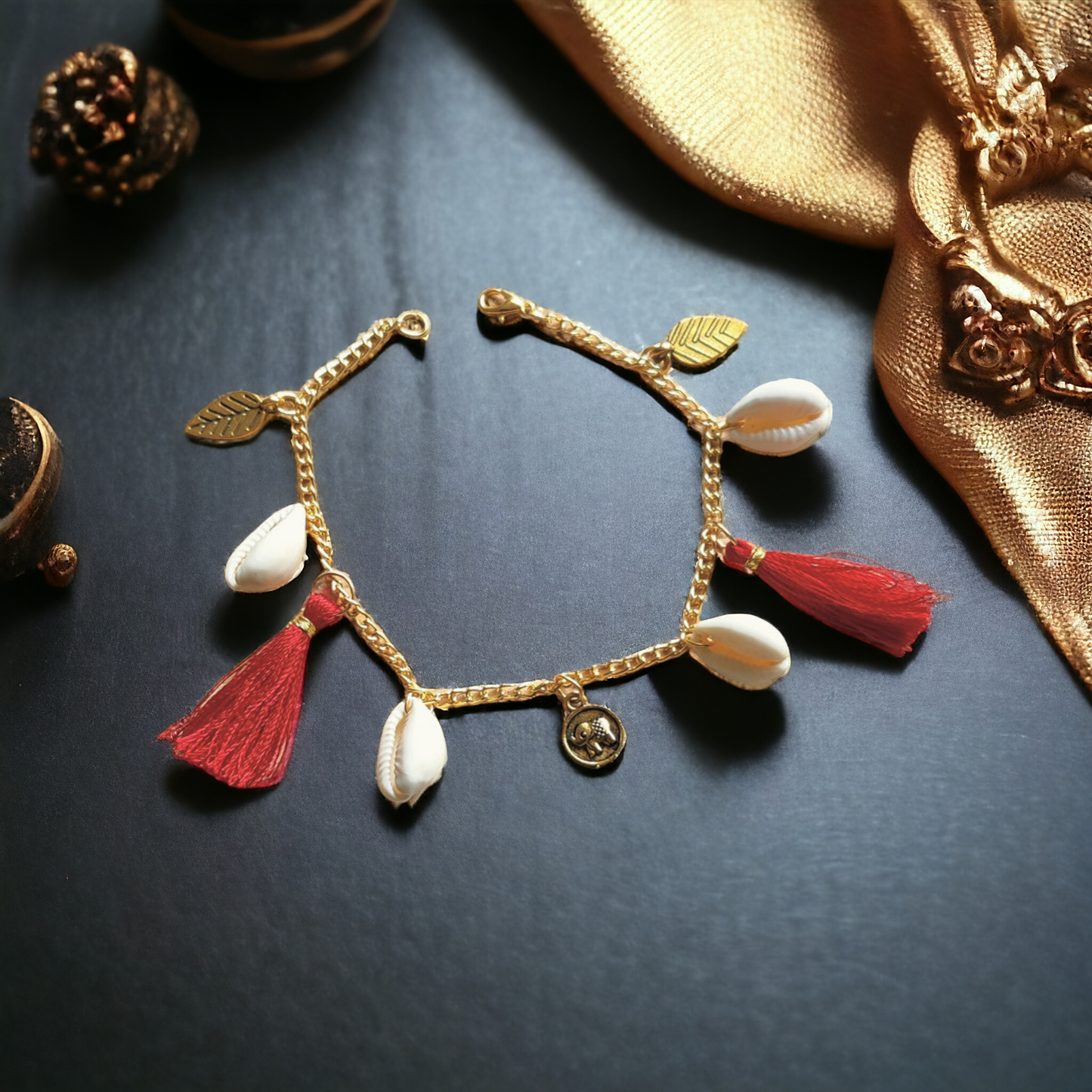 Fancy Bracelet Made Of Golden Chain, Cowrie, Silk Threads & Charms