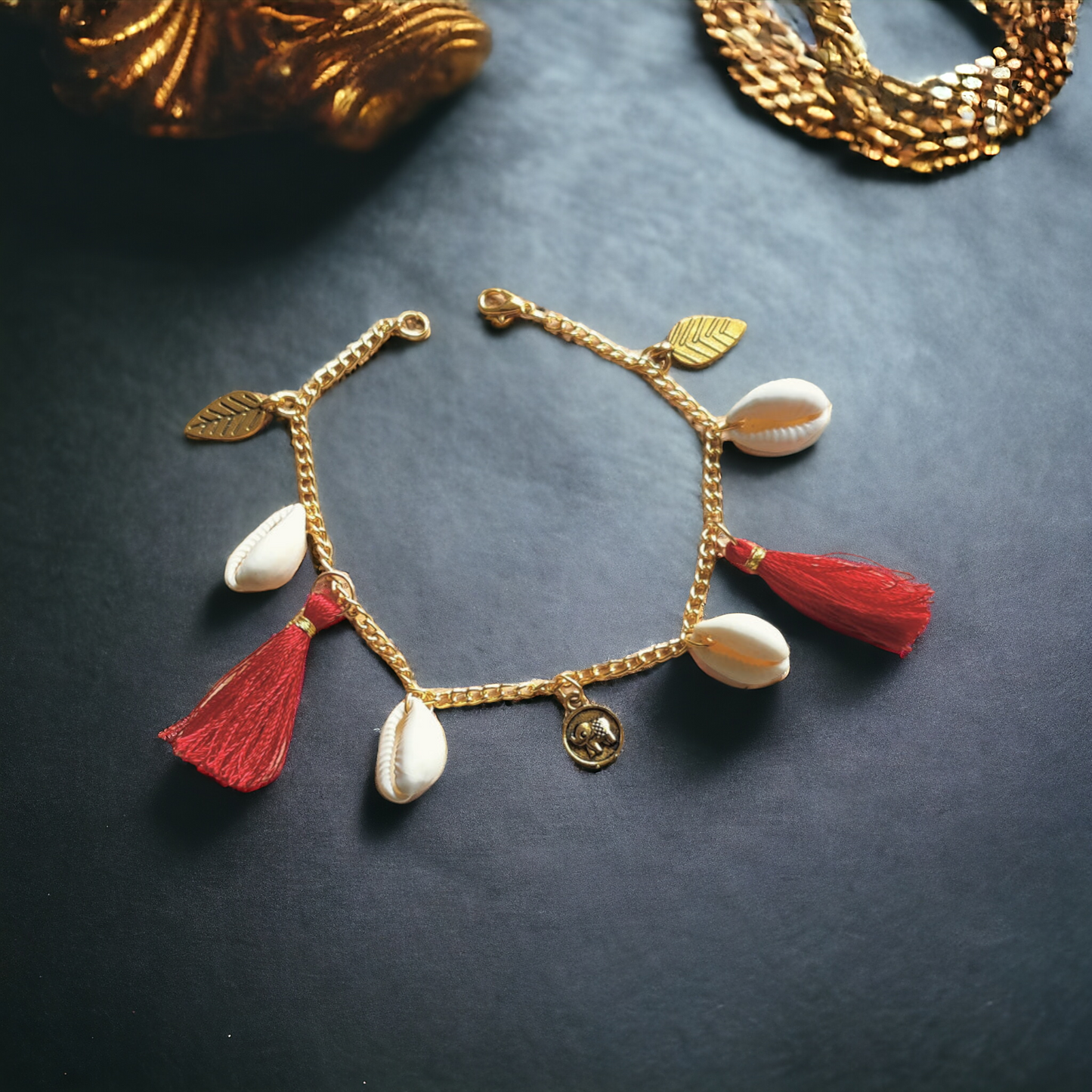 Fancy Bracelet Made Of Golden Chain, Cowrie, Silk Threads & Charms